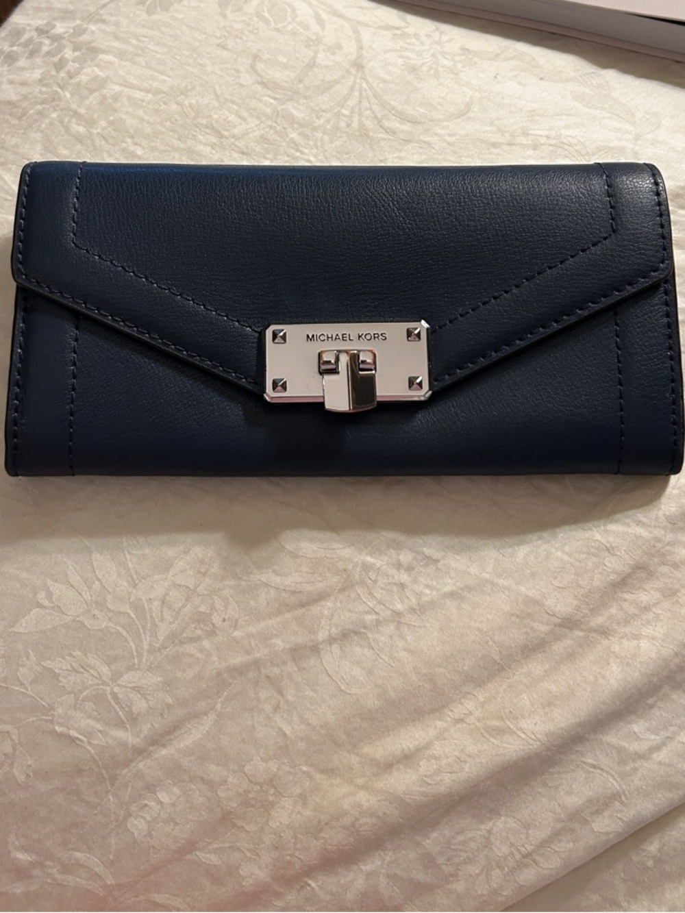 Michael Kors navy leather envelope wallet with silver hardware lock